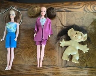 Two Barbie dolls…one troll