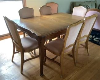 Dining room table with 2 leaves and 8 chairs..presale $225