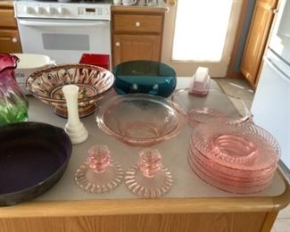 Pink depression glass pieces and other vases