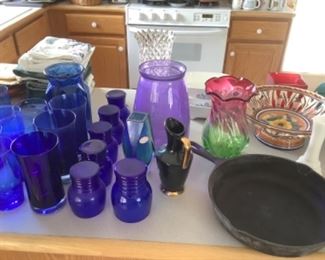 Cast iron skillet, royal blue glasses and vases