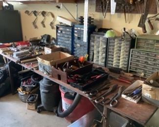 Lots of tool cases/storage pieces, small hand tools, dry vac etc