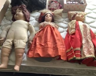 Three larger dolls