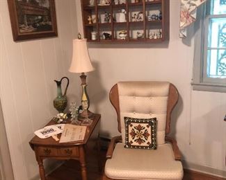 Maple chair, side table , lamp, wall art, shelf with miniature figurines.  