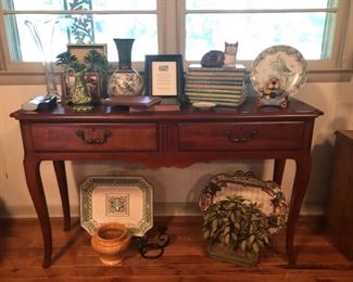 Cherry console table, books and bric-a-brac.