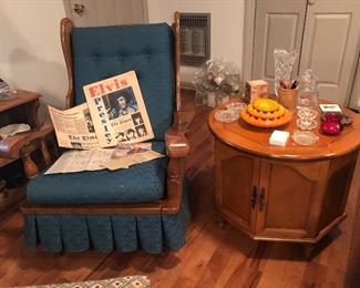 Vintage rocker, round maple table, Elvis memorabilia.