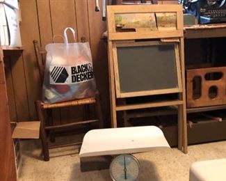 Vintage baby scale,  vintage stand up chalk board, large black and decker bag full of yarn, wagon chair, vintage typewriter, wood stool.