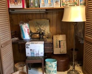 Rotary Special sewing machine in wooden stand, bench, set of 16 glasses, baskets, floor lamp, metal trash can, Christmas and Easter decorations (top shelf).