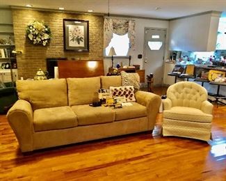 Nice clean sofa,  swivel rocker chair, vintage cameras