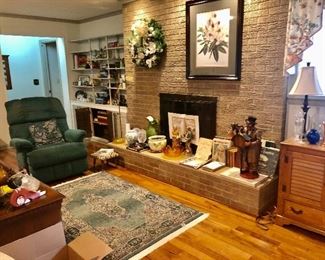 Over view of living room, Lazy boy recliner, vases,  vintage books magnolia picture and wreath, Old Masters oriental  rug.