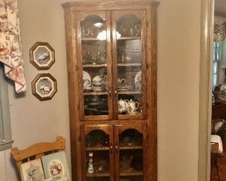 Oak corner cabinet, wall plates, boxes of vintage stationary in chair.