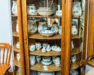 Antique Curved Glass Oak Display Cabinet filled with Metlox Dishes & Serving Pieces
