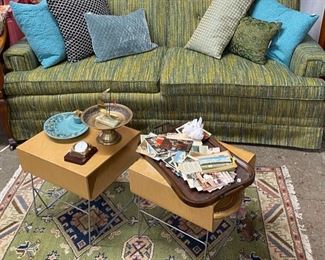 MCM couch, bentwood tables and beautiful rug. Old postcards and photos and MCM ashtrays