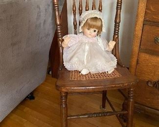 Antique chair, doll