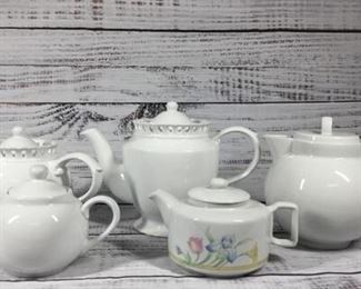 Set of Five White Teapots
