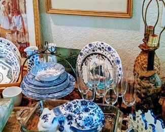 Multiple china sets throughout the rooms and serving pieces. 