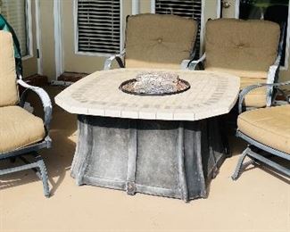 3.  Fire pit and four outdoor arm chairs with cushion  • $250