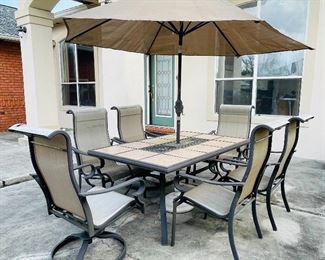 27.  Patio set with umbrella six chairs •  $195
