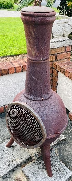 26.  Cast iron chimney top outdoor fireplace •  $150