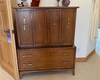 An amazing walnut dresser from Kent Coffey.  Great condition for its vintage age.  Very few flaws seen.  Measures 42"W x 20"D x 52"T.  One piece, top does not come off.  A rare find!  