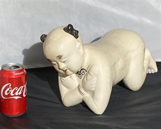 #15 - 19th c. Cizhou boy pillow
More photos: https://flic.kr/s/aHsmWpb55A
9”tall x 16”long x 6”deep.
Crackle throughout. Some discoloration on face and body. Firing flow on left thigh. Small chip on inner right arm.