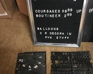 Sign with small white letters.