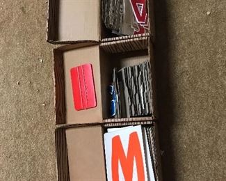 Three boxes of vinyl letters.