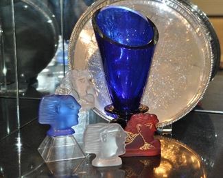 A Fantastic Collection of Vintage Daum Crystal Kallisti Blanc by A. Fassianos Face Statues shown with a Stunning Cobalt Blue Blown Glass Vase and one of the many Silver-plate Serving Trays Available