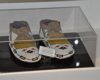 In the Display Case:  Pair of Plains Cree Moccasins, c.1900.  Soft Sole, Tanned Hide, Completely Beaded with Glass Seed Beads, from The Cowboy Trader
