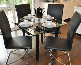 Gorgeous 36" Square Kitchen Table with Thick Beveled Glass Top and Black Steel Legs and a Set of 4 Black Zuo Modern Drana Chairs with Black Leatherette Seat and Chromed Steel Swoop Base