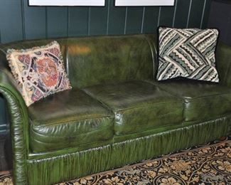 Dark Green Leather Sofa, 76"w x 28"h x 30"d.  Shown with Decorative Pillows