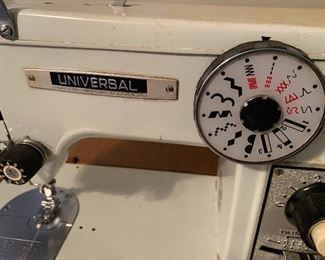 Universal sewing machine in cabinet