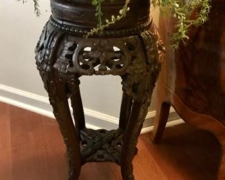 Carved plant stand