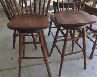 Wooden swivel bar stools.