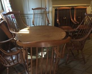 Antique breakfast table from Philadelphia (two leaves) and eight antique Windsor chairs.
