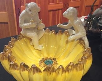 Unique ceramic banana bowl with monkeys.