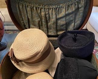 Vintage suitcase with pillbox hats.
