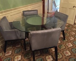 Mitchell Gold and Bob Williams chairs and glass table on chrome stand.