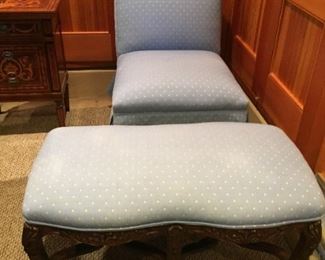 Blue and white upholstered chair and ottoman.
