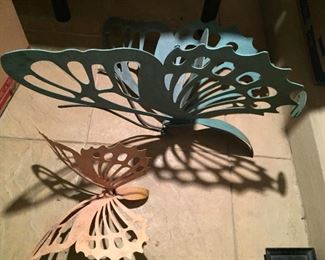 Metal butterfly chair and metal sculpture.