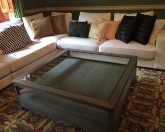 10-piece white sectional, can be sold as one piece or multiple with designer pillows. Also, very nice wooden coffee table with glass.