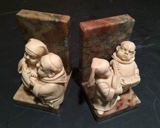 Marble and quartz bookends with monks.
