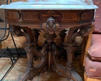 Carved table with marble top