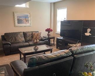 Black brand new leather electric reclining couches in excellent condition 
700 each 