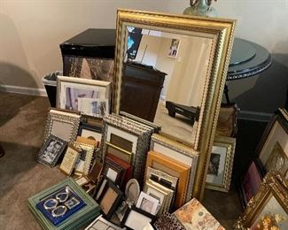 Several pieces of wall art , mirrors 