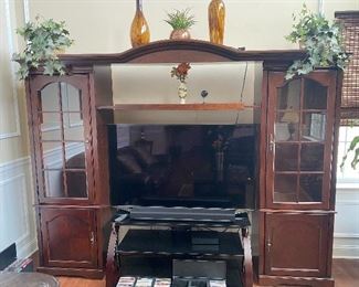 Entertainment center with detachable curio cabinets 