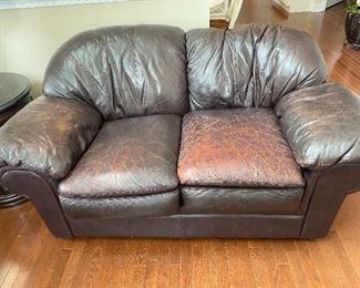 Brown leather couch/ faded 