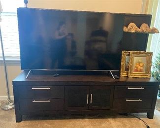 Tv stand with shelves for displaying decor 