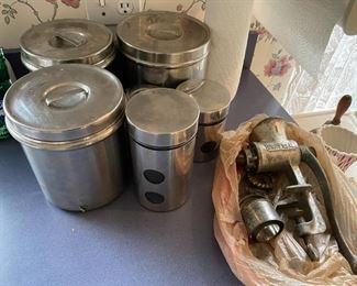 Vintage kitchen canisters and meat grinder