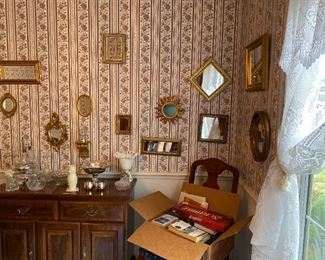 lots of gold mirrors, small buffet by Broyhill, Silverplate and crystal