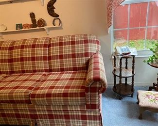 Plaid sleeper sofa, lots of small decor